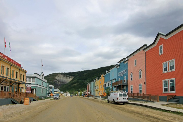 a train is parked on the side of a building